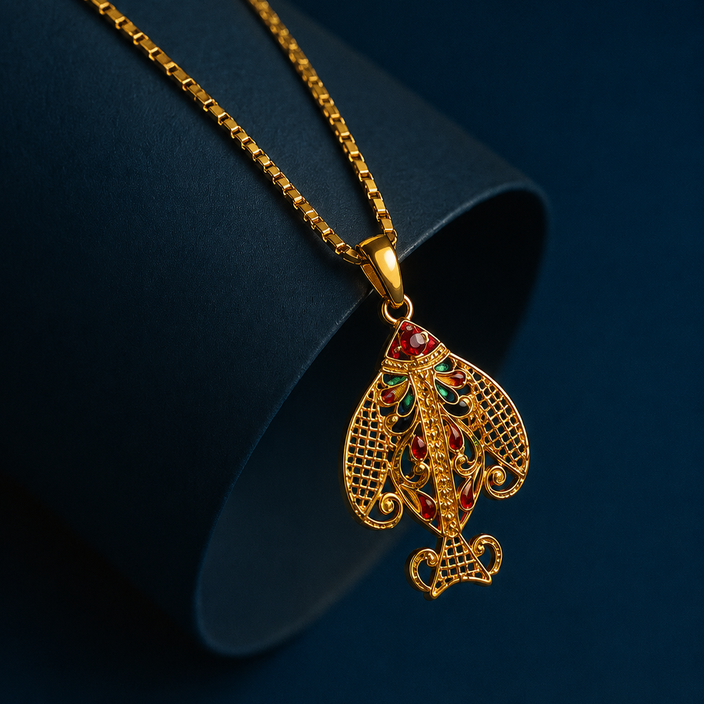 Gold necklace with a detailed pendant on a dark background
