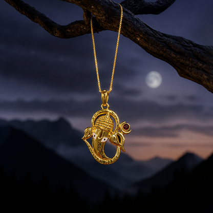 Gold pendant on a chain against a mountainous landscape with a moonlit sky